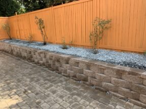 Concrete Retaining Wall with Gravel and Plants